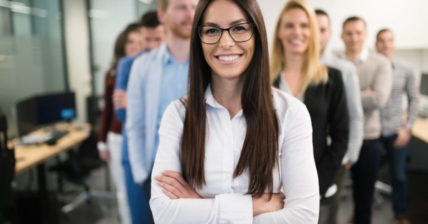 Portrait of female smiling company ceo in office